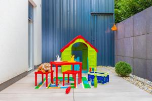 a toy play set with a table and a house at Villa Luna&Aurora in Selce
