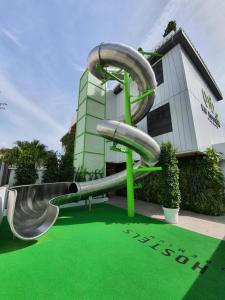 a water slide in front of a building at MB Hostels Premium ECO - Adults Recommended in Nerja