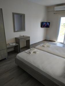 A bed or beds in a room at Lighthouse Apartments