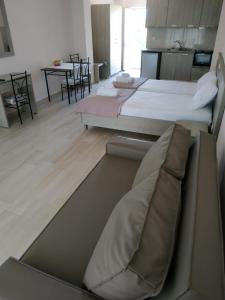 A bed or beds in a room at Lighthouse Apartments