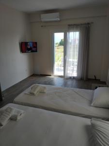 A bed or beds in a room at Lighthouse Apartments