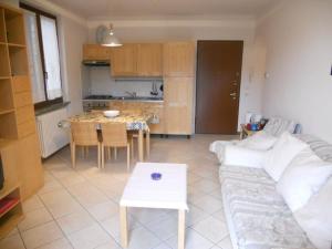 a living room with a couch and a table at Al Borghetto in Lierna