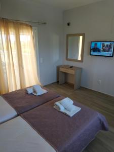 A bed or beds in a room at Lighthouse Apartments