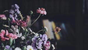 a bunch of flowers in a vase at Moon and Chalice Boutique Hotel in Kunming
