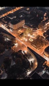 an overhead view of a city at night with a bridge at Moon and Chalice Boutique Hotel in Kunming