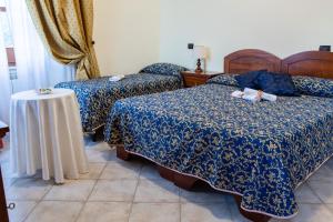 Postel nebo postele na pokoji v ubytování Hotel Il Cavalier D'Arpino