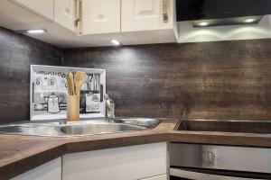 a kitchen with a sink and a counter top at Haus Jensen 1 in List