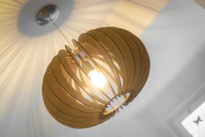 a brown light fixture hanging from a ceiling at Haus Jensen 1 in List +40 photos