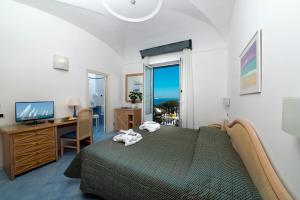 Postel nebo postele na pokoji v ubytování Hotel Floridiana Terme