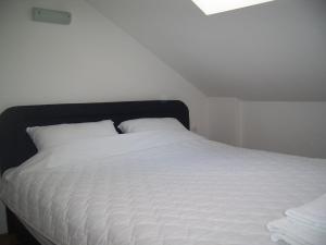 Postel nebo postele na pokoji v ubytování Tedi & Kiki Apartment