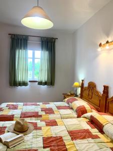 a bedroom with a bed with a hat on it at Casas Balcón del Mar in El Paso