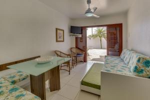 a living room with a couch and a table at Pousada Saint Paul in Florianópolis