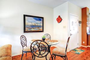 a dining room with a table and chairs at Beach Club Condos in Padre Island