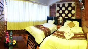 Postel nebo postele na pokoji v ubytování Hostal Comarca Imperial