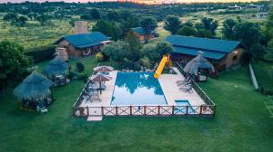 an aerial view of a house with a swimming pool at Complejo Tierra Mia in Panaholma