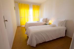 Postel nebo postele na pokoji v ubytování Casa da Praia