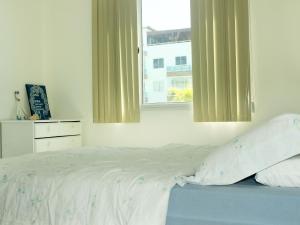 Voodi või voodid majutusasutuse Corais de Búzios #204 - Apartamento por Carpediem toas