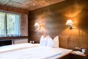 Postel nebo postele na pokoji v ubytování Chalet Waldhaus Rappakopf