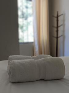 Ένα ή περισσότερα κρεβάτια σε δωμάτιο στο RUMIQOLQA Machupicchu Hotel
