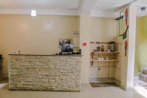 Η κουζίνα ή μικρή κουζίνα στο RUMIQOLQA Machupicchu Hotel