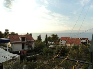a view of houses and the ocean in the distance at Apartments Jere - with parking in Sutivan