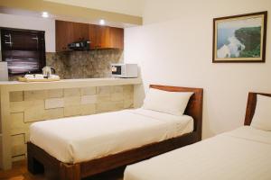 Postel nebo postele na pokoji v ubytování Vidi Boutique Hotel