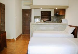 Kuchyň nebo kuchyňský kout v ubytování Vidi Boutique Hotel