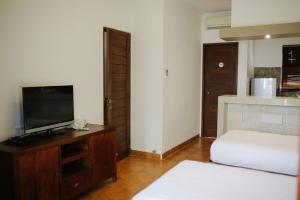 TV a/nebo společenská místnost v ubytování Vidi Boutique Hotel