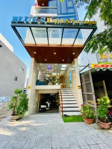 a hotel entrance with a sign on top of it at Blue-S Hotel & Apartment in Da Nang