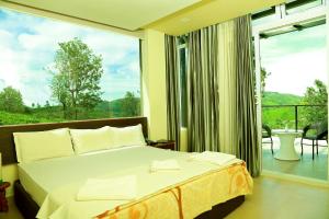 Ένα ή περισσότερα κρεβάτια σε δωμάτιο στο Sunvalley Homestay