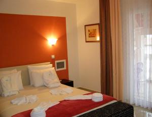 Postel nebo postele na pokoji v ubytování Hotel Wellness & Spa Angelo Gabriel