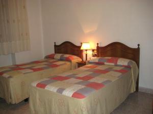 Postel nebo postele na pokoji v ubytování Hostal Los Andes