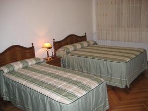 Postel nebo postele na pokoji v ubytování Hostal Los Andes