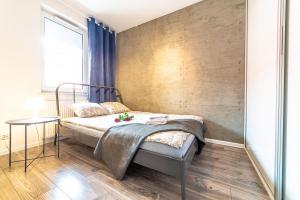 Posteľ alebo postele v izbe v ubytovaní Apartament Sobieskiego 2a Parking gratiss