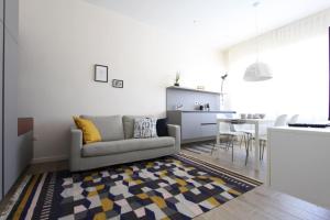 a living room with a couch and a table at casa Ginepro in Terralba