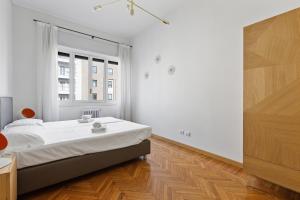 Posteľ alebo postele v izbe v ubytovaní GuestHost - Porta Vittoria Central Apartment