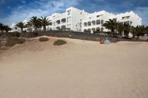 a pile of sand on the beach in front of a building at Sotavento Beach Club in Costa Calma