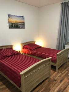 Ein Bett oder Betten in einem Zimmer der Unterkunft Wagner Ferien Apartments
