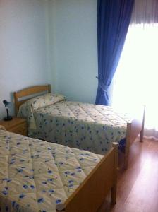 Ένα ή περισσότερα κρεβάτια σε δωμάτιο στο Pensión Ruiz