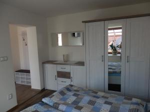 Posteľ alebo postele v izbe v ubytovaní Apartmány 27