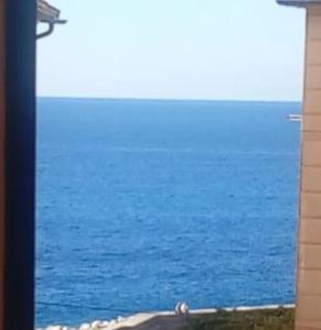 a view of the ocean from a window at Embarcadero with New Powerful WiFi in Camogli