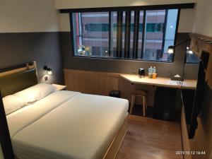 Ένα ή περισσότερα κρεβάτια σε δωμάτιο στο City Suites - Main Station