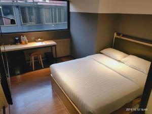 Ένα ή περισσότερα κρεβάτια σε δωμάτιο στο City Suites - Main Station