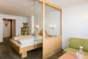 Postel nebo postele na pokoji v ubytování Hotel Anemone