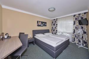 Tempat tidur dalam kamar di Hotel Ganslhof - Adults only