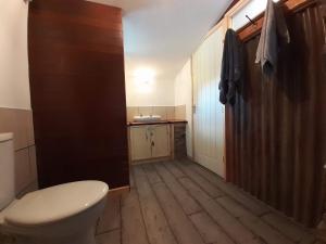 a bathroom with a toilet and a sink at Oakdean Cottage Yurt in Blakeney