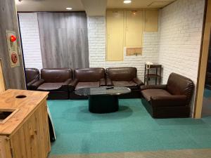 A seating area at Capsule Hotel 310
