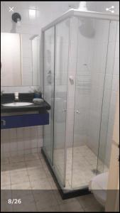 a bathroom with a shower and a sink at Flat mobiliado praia, João Pessoa PB PROMOÇÃO in Cabedelo