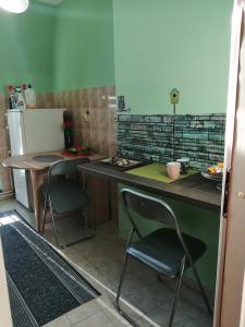 Kuchyň nebo kuchyňský kout v ubytování Apartman Red wall