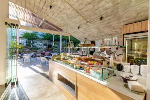 a kitchen with a counter with food on it at Len Art Selected Studios in Faliraki